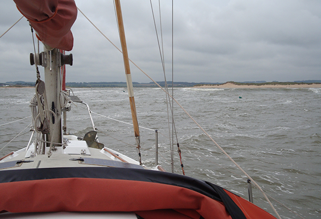 A sailor using pilotage skills to take his boat into Burnham Habour