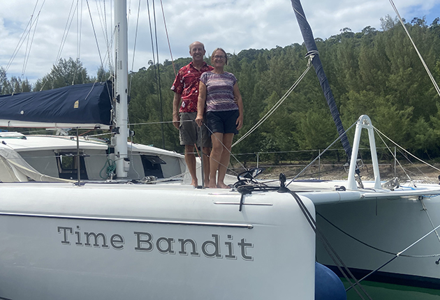 A couple on the trampoline of their catamaran