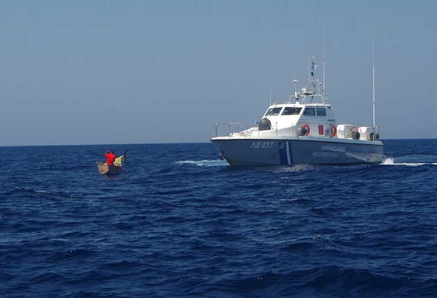 A coastguard boat rescuing migrants at sea