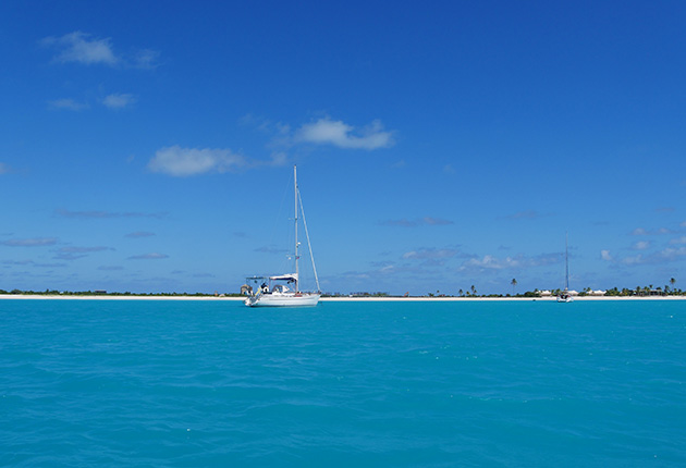 A yacht at anchor in an anchorage