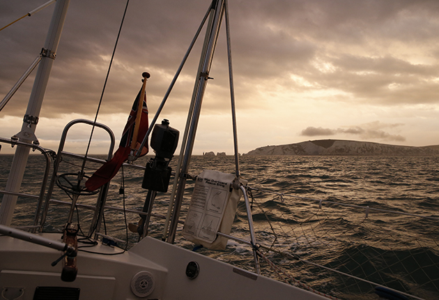 A yacht sailing at dawn
