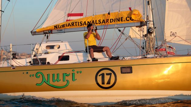 2022 Golden Globe Race skipper Michael Guggenberger using a sextant on the deck of his boat