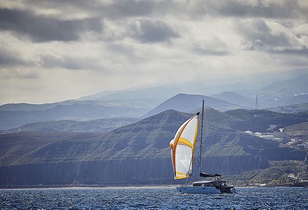 Yachts leave Las Palmas, Gran Canaria for the 2,700 mile voyage to St Lucia. Some sailed with twin headsails; others flew spinnakers and mainsails