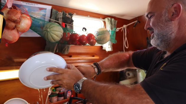 Golden Globe Race skipper Arnaud Gaist cooking onboard his boat