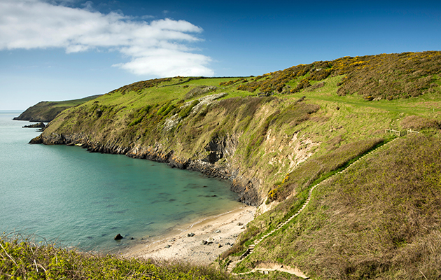 A cove in Wales with a beach