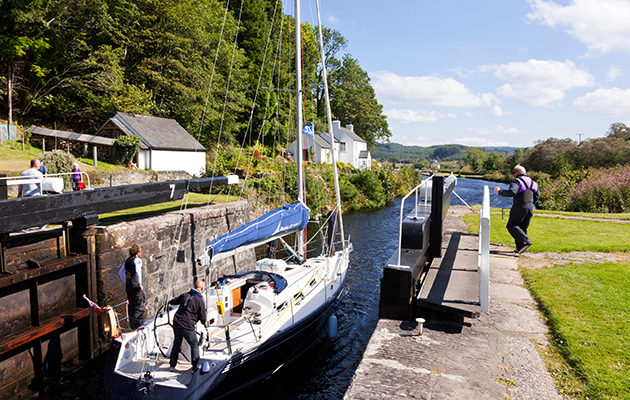 A yacht going through a lock