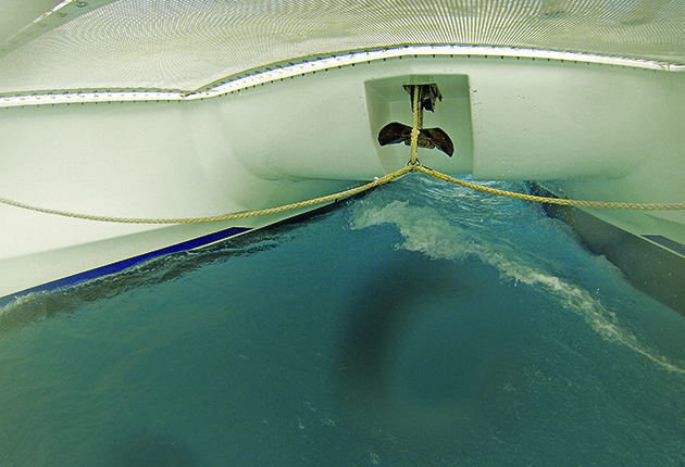 Catamaran mooring skills for a yacht charter holiday: A bridle should already be rigged. Make sure a retrieval line is rigged, so you can bring it back up to the roller afterwards
