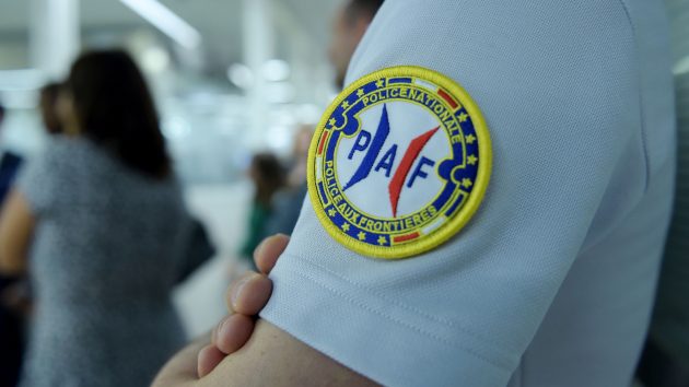 Police Aux Frontières officers handle sailors checking into and out of France. Credit: Getty
