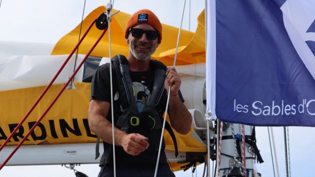 Michael Guggenberger wearing a hat and sunglasses on a boat