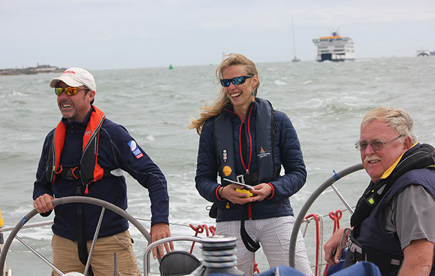 Crew laughing on a yacht in the Solent