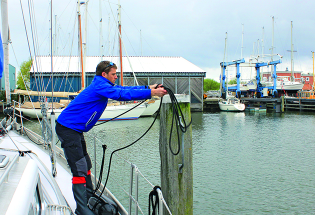 box berth put the windward line over the post and bring back to the boat