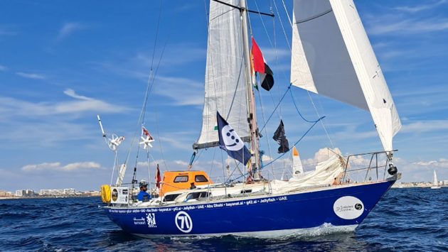 Abhilash Tomy sailing his Rustler 36 with a blue hull and white sails. He has expressed frustration with the race course