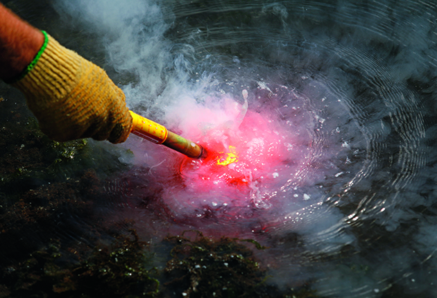 A flare being put into water