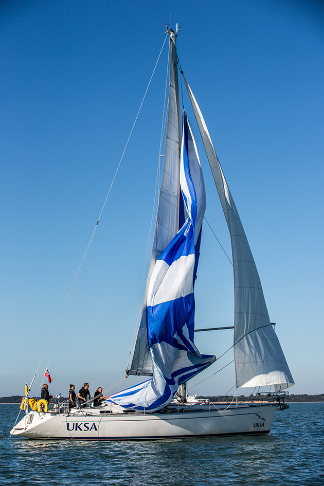A spinnaker being dropped on a yacht
