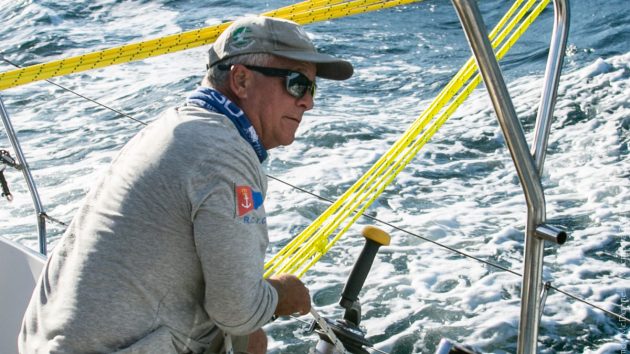 A man wearing a cap sailing