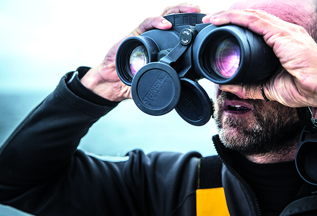 Judging distances at sea: Binoculars with a built-in compass will help you accurately identify a transit