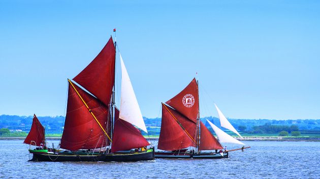 Two historic Thames sailing barges racing on the river Blackwater. (Photo by: Loop Images/Universal Images Group via Getty Images)