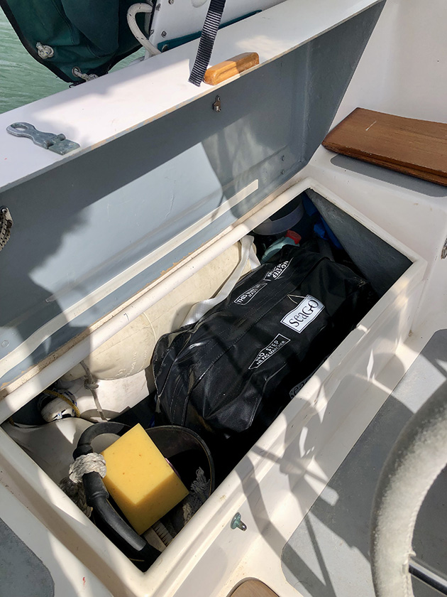 A liferaft on a yacht being prepared for canal cruising in France