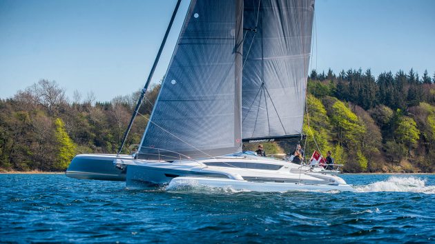 A trimaran sailing on the water