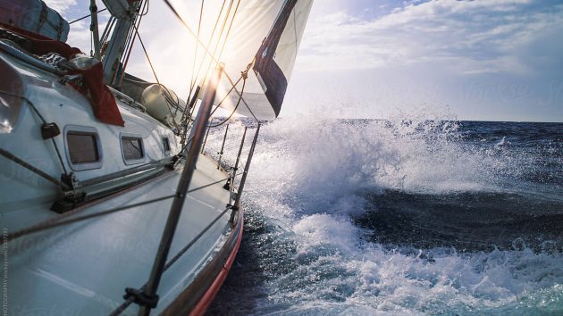 A yacht with a white hull heeling