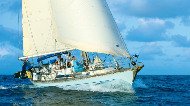 The Penny Oyster, sailing with the crew aboard. The weather is fair.