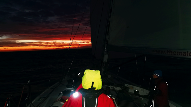 Sailing through the ocean at night.