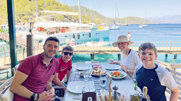 Iain, Rachel, and their sons Noah and Oliver enjoy lunch at Sarsala Bay