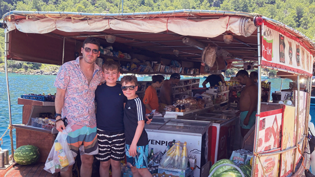 Iain, Noah and Oliver catch up on food essentials in Manastir Koyu